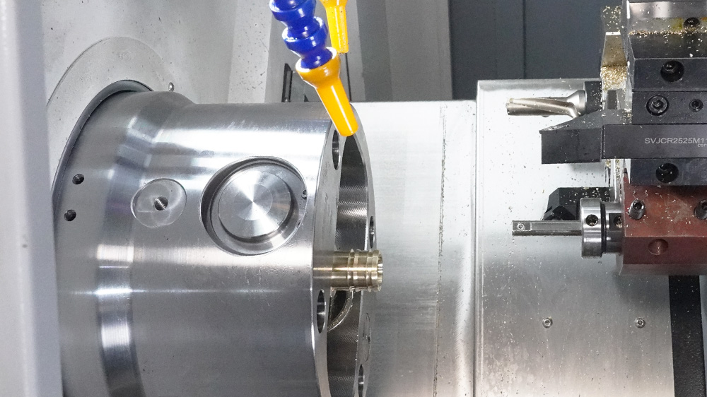 Turret CNC lathe in operation, showing multi-station tool turret and workpiece