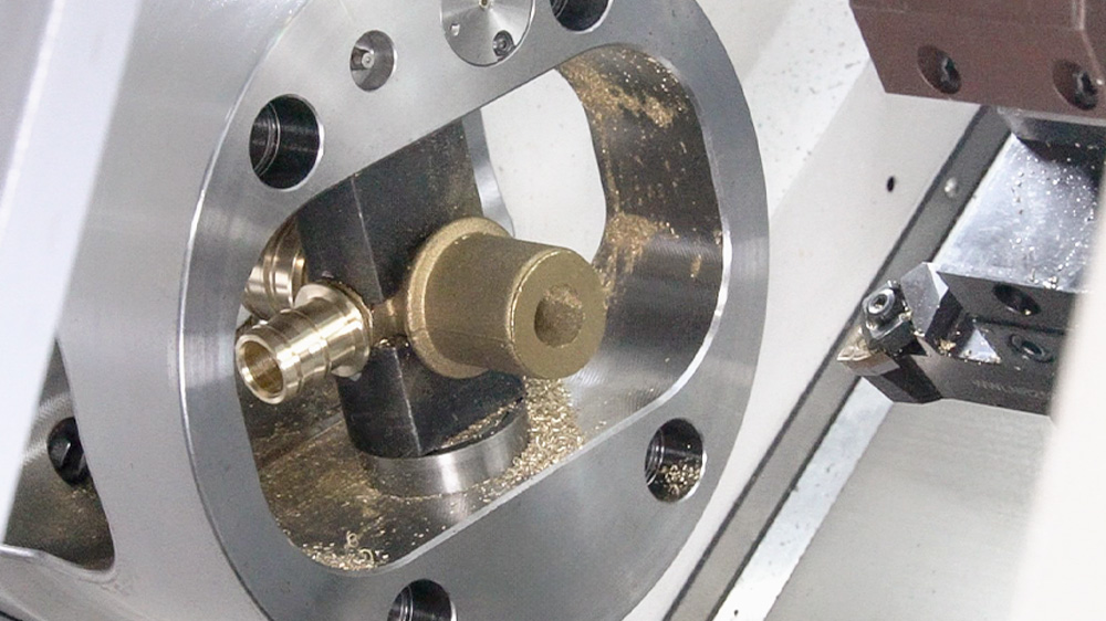 Turret CNC machine tools with indexing chucks perform multi-angle machining of metal parts